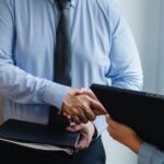 entrepreneurs shaking hands after agreement